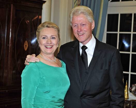 Former United States President Bill Clinton and U.S. Secretary of State Hillary Rodham Clinton look on as the seven recipients of the 2012 Kennedy Center Honors pose for a photo following a dinner hosted by Secretary Clinton at the U.S. Department of State in Washington, D.C. on Saturday, December 1, 2012.  WAX20121201102