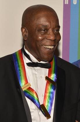 2012 Kennedy Center Honoree Chicago blues legend Buddy Guy poses for photographers on the red carpet as he arrives for an evening of gala entertainment at the Kennedy Center, December 1, 2012, in Washington, DC. The Honors are bestowed annually on five artists for their lifetime achievement in the arts and culture.  WAP20121201504