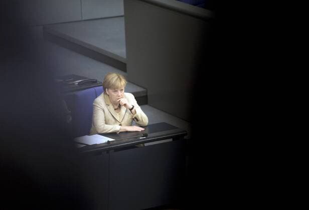 Angela Merkel, Bundestag, Debatte Euro-Rettungsfond DEU, Deutschland, Germany, Berlin, 29.09.2011 Angela Merkel, Bundeskanzlerin und Vorsitzende der CDU, auf der Regierungsbank im Plenarsaal Deutscher Bundestag anlaesslich der Debatte zum Euro-Rettungsfond EFSF. Plenarsaal Deutscher Bundestag, Deutschen Bundestag, Plenum, Deutscher Bundestag, Parlament, Bundestagsdebatte, Plenardebatte, Deutsche Politik, Bundespolitik, QF Querormat, 2011, Finanzen, Finanzwirtschaft, europaeische, Europa, Feature, Staat, Finanzkrise, Rettungsfond, Krisenfond. Portrait Portraet, Poltiker Chancellor Angela Merkel during a debatte about the Euro rescue fond EFSF inside the German parliament Deutscher Bundestag. German parliament, Germany, Politics, budget, finance, economy, politician.