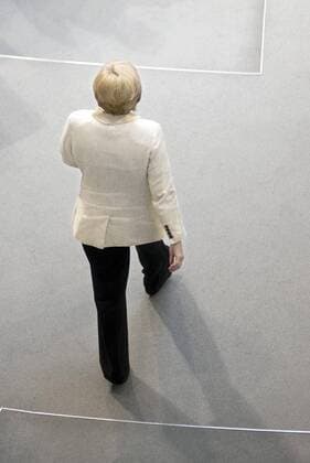 Angela Merkel, Bundestag, Debatte Euro-Rettungsfond DEU, Deutschland, Germany, Berlin, 29.09.2011 Angela Merkel, Bundeskanzlerin und Vorsitzende der CDU, von hinten auf dem Weg zur Regierungsbank im Plenarsaal Deutscher Bundestag anlaesslich der Debatte zum Euro-Rettungsfond EFSF. Plenarsaal Deutscher Bundestag, Deutschen Bundestag, Plenum, Deutscher Bundestag, Parlament, Bundestagsdebatte, Plenardebatte, Deutsche Politik, Bundespolitik, HF Hochformat, 2011, Finanzen, Finanzwirtschaft, europaeische, Europa, Feature, Staat, Finanzkrise, Rettungsfond, Krisenfond. Portrait Portraet, Poltiker Chancellor Angela Merkel during a debatte about the Euro rescue fond EFSF inside the German parliament Deutscher Bundestag. German parliament, Germany, Politics, budget, finance, economy, politician.