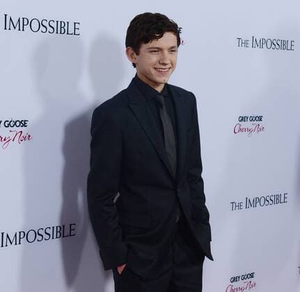 English actor Tom Holland, a cast member in the dramatic thriller motion picture The Impossible , attends the premiere of the film at the ArcLight Cinerama Dome in the Hollywood section of Los Angeles on December 10, 2012. The film is based on the Phuket, Thailand 2004 Tsunami account of a family caught, with tens of thousands of strangers, in the mayhem of one of the worst natural catastrophes of our time.  LAP2012121024