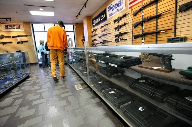 (130110) -- CHANTILLY, Jan. 10, 2013 (Xinhua) -- People look around at a gun shop in Chantilly, Virginia, the United States, on Jan. 10, 2013. U.S. Vice President Joe Biden said on Thursday he will present proposals of the White House gun-control task force to President Barack Obama by next Tuesday. (Xinhua Fang Zhe) US-GUN-CONTROL 