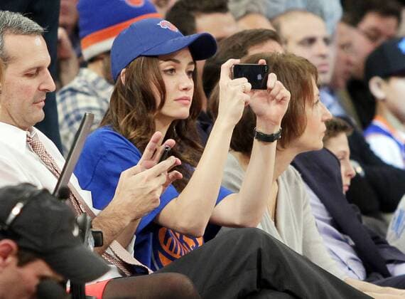 Emmy Rossum watches the Oklahoma City Thunder play the New York Knicks at Madison Square Garden in New York City on March 7, 2013. The Thunder defeated the Knicks 95-94.  NYP20130307130