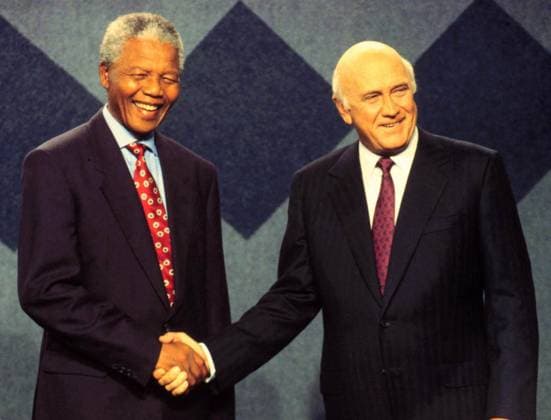 IMAGO History, Ende der Apartheid in S?dafrika: 1990-1994 National Party (NP) leader Frederik Willem (FW) de Klerk and African National Congress leader (ANC) Nelson Mandela shake hands before a pre-April 27 election live television debate watched by an estimated 5 million South Africans, historical apartheid elections 1994, Editorial use only.
