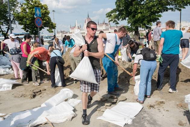 BUDAPEST, June 09, 2013 - Volunteers fill sandbags as part of flooding precautionin in central Budapest, capital of Hungary, June 9, 2013. The water level of the Danube river stood at 8.91 meters in Budapest Sunday night, 0.31 meters more than the record high in 2006.(Xinhua Attila Volgyi) (yc) HUNGARY-BUDAPEST-DANUBE LEVEL-RECORD HIGH 