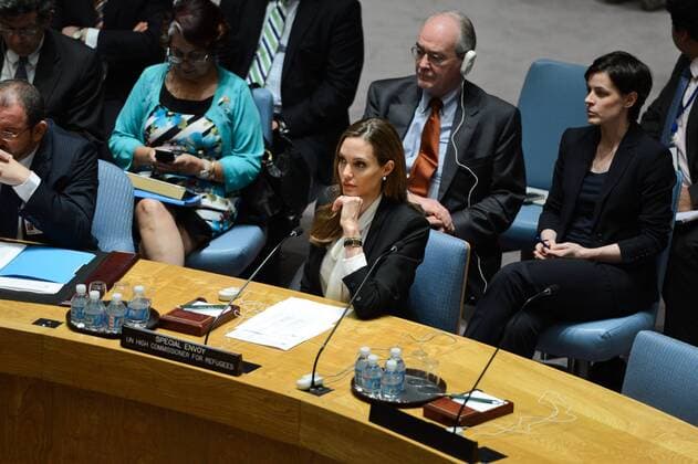 (130624) -- NEW YORK, June 24, 2013 (Xinhua) -- Actress Angelina Jolie (C), the Special Envoy of the United Nations High Commissioner for Refugees (UNHCR), attends a UN Security Council meeting at the UN headquarters in New York, on June 24, 2013. Jolie on Monday urged the UN Security Council to tackle sexual violence in war zones, promoting strong actions from the international community on this issue. (Xinhua Niu Xiaolei) UN-NEW YORK-ANGELINA JOLIE 