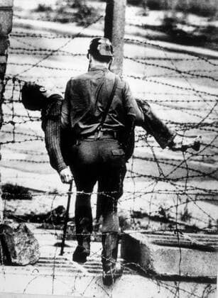 And Sudden Death - A shot in the back toppled young Peter Fechter just short of freedom, as he tried to flee over the Wall from East Berlin. UnitedArchives00133192 