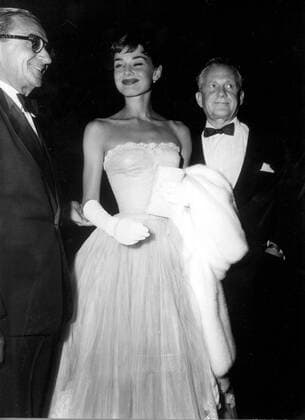 At the premier of Roman Holiday held at the Village Theatre, Westwood, California, here were songwriter Irving Berlin, actress Audrey Hepburn and Paramount production chief Son Hartman. 19th September 1953 UnitedArchives00178925 