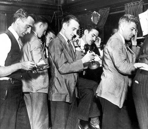 Wall Street Crash. Showing clerks in Wall Street New York broker s office as they phone requests for more margin after one of the busiest days the Exchange had ever known 20 October 1929 UnitedArchives00549607 