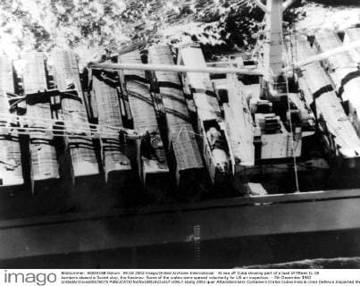 At sea off Cuba showing part of a load of fifteen IL-28 bombers aboard a Soviet ship, the Kasimov. Some of the crates were opened voluntarily for US air inspection. - 7th December 1962 UnitedArchives00576075 