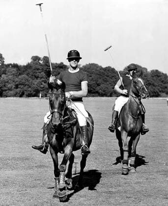 Duke of Edinburgh plays polo for Maidensgrove against Hertfordshire at Sutton Park Polo Club, Guildford Surrey in the Cowdray Park Junior Challenge Cup. The Duke raises his stick when his team won the Match. UnitedArchives00599153 