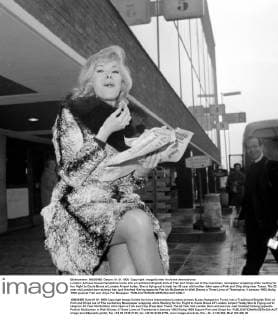 London: Actress Susan Hampshire tucks into a traditional English dish of Fish and Chips out of the customary newspaper wrapping while waiting for her flight to Costa Brava at London Airport today. She is flying out to help her 30 year old brother John open a Fish and Chip shop near Tossa. The 22 year old London born actress has just finished filming opposite Patrick McGoohan in Walt Disney s Three Lives of Thomasina. 4 January 1963 UnitedArchives00833689 