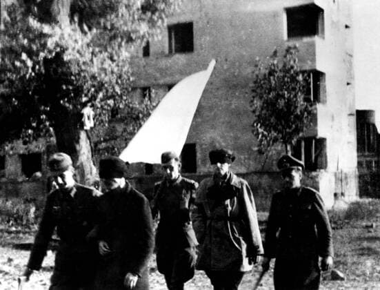 Warsaw after the Polish resistance ended, November, 1944. Polish officers escorted by German officers, going to be interrogated. UnitedArchives00930773 