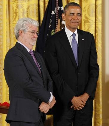 President Barack Obama stands next to George Lucas before awarding him the 2012 National Medal of Arts for his contributions to American cinema during a ceremony in the East Room of the White House in Washington, D.C. on July 10, 2013.  WAP20130710802