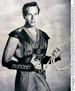 Charlton Heston in Ben-Hur: A Tale of the Christ is a sword-and-sandal historical fiction epic originally depicted in the 1880 book by American general and author Lew Wallace. Ben-Hur: A Tale of the Christ has since been adapted into a Broadway play, silent films, talkies, and a musical. Â UnitedArchives00935404 
