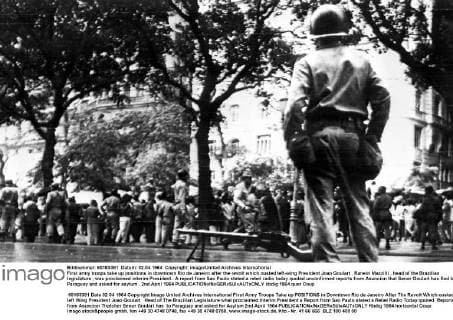 First army troops take up positions in downtown Rio de Janeiro after the revolt which ousted left-wing President Joao Goulart . Raneiri Mazzilli , head of the Brazilian legislature , was proclaimed interim President . A report from Sao Paulo stated a rebel radio today quoted unconfirmed reports from Asuncion that Senor Goulart has fled to Paraguay and asked for asylum . 2nd April 1964  UnitedArchives00943599
