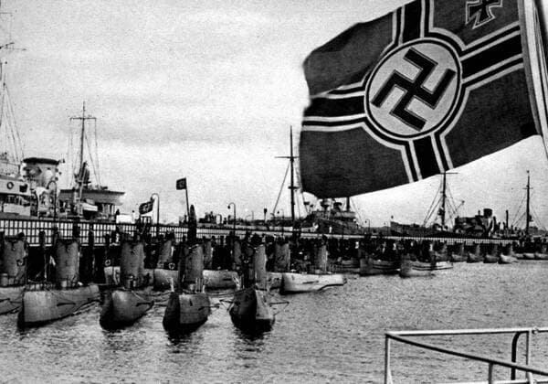 German submarines with their mother ships a photograph taken at Kiel showing some twenty five boats of the coastal and sea going classes and on the left behind the jetty is the Saar February 1939 Â  UnitedArchives01015566