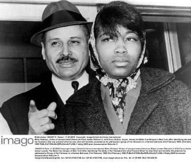 Betty Shabazz, widow of assassinated American black leader Malcom X, with Percy Sutton, lawyer, leaves the Belle Vue Morgue in New York after identifying the body of her husband. She was present when he was shot and mortally wounded as he addressed a group of his followers in a Harlem ballroom 21st February 1965. 23rd february 1965  UnitedArchives01024350