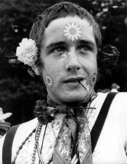 Flower child with joss stock in his mouth Thee day Festival of the Flower Children which opened in the park at Woburn Abbey, stately home in Bedfordshire of the Duke and Duchess of Bedford. More than 50,000 hippies are expected to attend thefestival before it closes on Monday night. 26th August 1967  UnitedArchives01033698