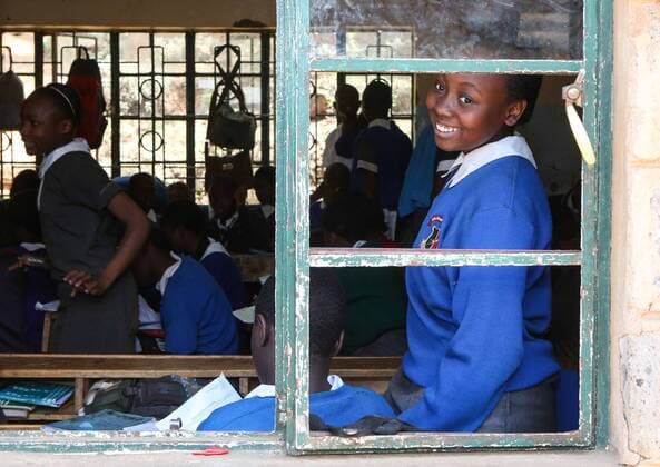 (131011) -- NAIROBI, Oct. 11, 2013 (Xinhua) - A girl looks out from the window at Raila Education Center in Nairobi, capital of Kenya, Oct. 11, 2013. On Dec. 19, 2011, the United Nations General Assembly adopted a resolution to declare 11 October as the International Day of the Girl Child, to recognize girls rights and the unique challenges girls face around the world. For its second observance, this year s day will focus on Innovating for Girls Education . (Xinhua Meng Chenguang) KENYA-NAIROBI-INTERNATIONAL DAY OF THE GIRL CHILD 