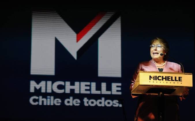 Michelle Bachelet, Chilean presidential candidate of the opposition center-left New Majority coalition, delivers a speech in front of San Francisco hotel, in Santiago, capital of Chile, on Nov. 17, 2013. Although Chile s opposition presidential candidate Michelle Bachelet took a big lead with 46.69 percent of the votes as 78.38 percent of the bollots were counted, the presidential election is most likely to face a runoff, the Electoral Service said. (Xinhua Jorge Villegas) CHILE-SANTIAGO-POLITICS-ELECTION-BACHELET 