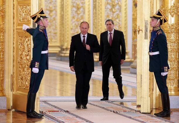 ITAR-TASS: MOSCOW, RUSSIA. JANUARY 16 2014. President of Russia Vladimir Putin (2nd L) an his aide Yuri Ushakov (2nd R) arrive for the ceremony of presenting credentials by foreign diplomats at the Grand Kremlin Palaceâ€™s St Alexander Hall.  premiumd Aufmacher RE135FBA