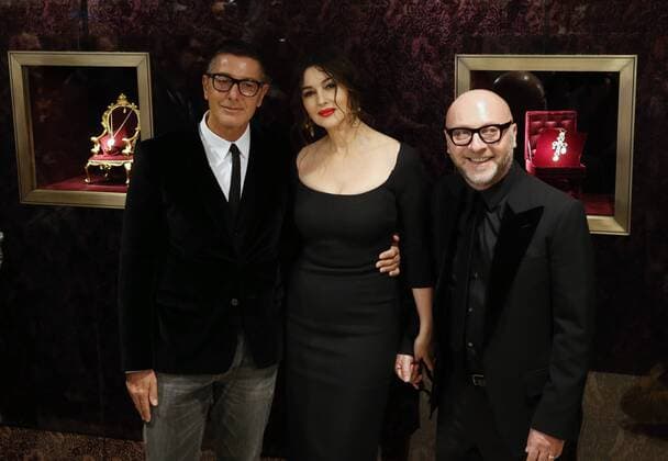 ITAR-TASS: MOSCOW, RUSSIA. MARCH 12, 2014. Italian actress Monica Bellucci (C) and fashion designers Stefano Gabbana (L), Domenico Dolce (R) attend the opening of a Dolce&Gabbana boutique in Moscow s TsUM department store.  premiumd RE13C81E