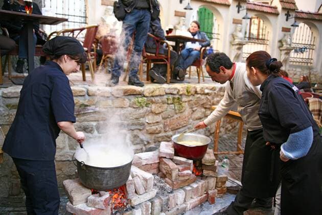 Chef Shevket of Feodosiia and his family cook traditional Crimean Tatar dishes in the yard of a restaurant in Lviv, March 13, 2014. Ukrinform. 
