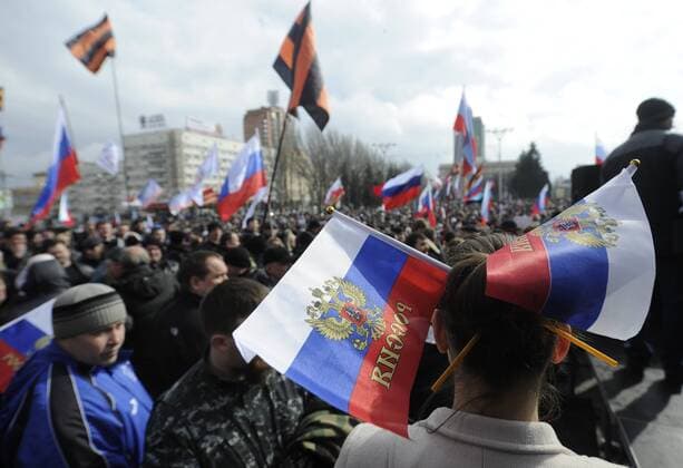 ITAR-TASS: DONETSK, UKRAINE. MARCH 15, 2014. Demonstrators hold Russian national flags during a mass rally in Donetsk, eastern Ukraine, in support of the upcoming referendum on the political status of Crimea.  RE13CE61