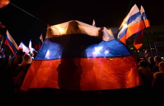 (140316) -- SIMFEROPOL, March 16, 2014 (Xinhua) -- Crimeans holding russian flags celebrate in front of the parliament building in Simferopol, capital of Ukraine s Autonomous Republic of Crimea, March 16, 2014. Although the 2014 Crimea referendum was still in process and results might take hours of processing before coming out, Crimeans in the capital city of the peninsula were already seen streaming toward the central city square for celebration. Local television quoted late Sunday an exit poll by the Crimean Republic Institute for Political and Social Studies as saying that 93 percent of voters in the Autonomous Republic of Crimea were in favor of reunification with Russia. (Xinhua Sadat) UKRAINE-CRIMEA-SIMFEROPOL-REFERENDUM-CELEBRATIONS 