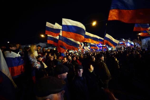 (140316) -- SIMFEROPOL, March 16, 2014 (Xinhua) -- Crimeans holding russian flags celebrate in front of the parliament building in Simferopol, capital of Ukraine s Autonomous Republic of Crimea, March 16, 2014. Although the 2014 Crimea referendum was still in process and results might take hours of processing before coming out, Crimeans in the capital city of the peninsula were already seen streaming toward the central city square for celebration. Local television quoted late Sunday an exit poll by the Crimean Republic Institute for Political and Social Studies as saying that 93 percent of voters in the Autonomous Republic of Crimea were in favor of reunification with Russia. (Xinhua Sadat) UKRAINE-CRIMEA-SIMFEROPOL-REFERENDUM-CELEBRATIONS 
