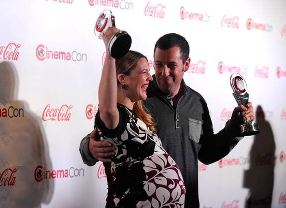 Female Star of the Year award winner Drew Barrymore (L) and Male Star of the Year award winner Adam Sandler arrive at the CinemaCon awards ceremony at the Pure Nightclub at Caesars Palace during CinemaCon, the official convention of the National Association of Theatre Owners in Las Vegas, Nevada onMarch 27, 2014.  LVP2014032740
