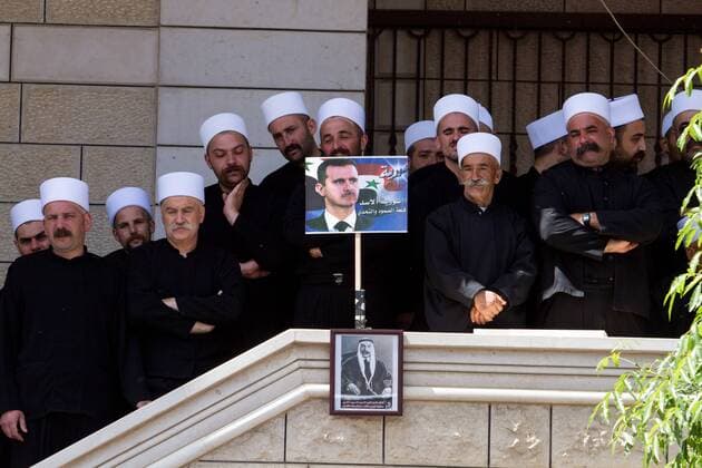 Members of the Druze community attend a rally marking Syria s Independence Day in the Druze village of Majdal Shams on the Golan Heights, on April 17, 2014. Hundreds of members of the Druze community took part in the rally on Thursday to mark Syria s independence day. Israel captured the Golan Heights in a 1967 war and then annexed the strategic territory overlooking northern Israel in 1981. (Xinhua JINI) MIDEAST-GOLAN HEIGHTS-DRUZE VILLAGE-MAJDAL SHAMS-SYRIA-INDEPENDENCE DAY 