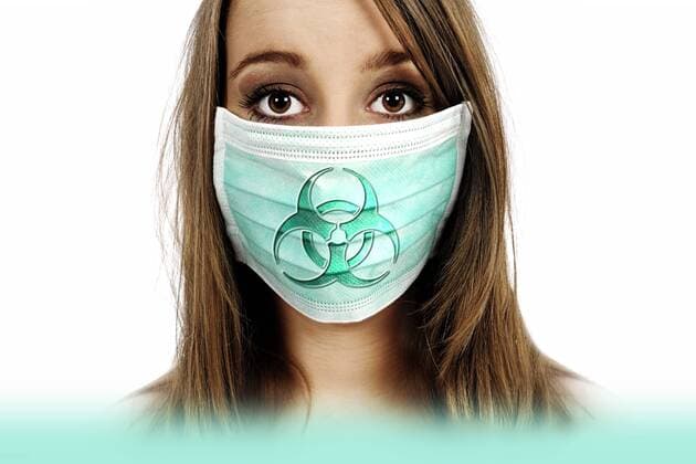 Frau mit Mundschutz und BiogefÃ¤hrdungszeichen, Symbolfoto Mers-Virus ** NUR FUER REDAKTIONELLE ZWECKE ** EDITORIAL USE ONLY **