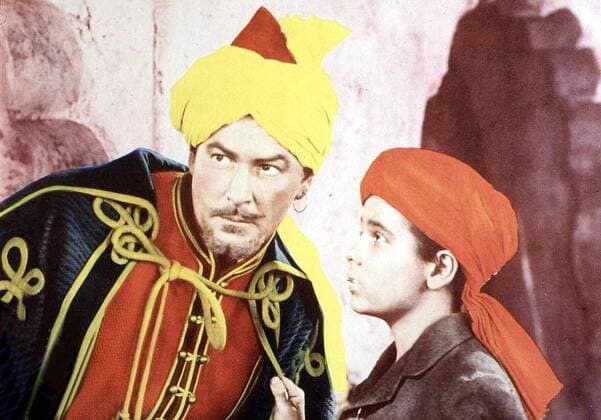 Errol Flynn, Dean Stockwell Der kleine Englaender Kim (Dean Stockwell) verkleidet sich als Inder, um nicht die englische Schule besuchen zu muessen. Mit dem Spion Mahbub Ali (Errol Flynn) erlebt er zahlreiche Abenteuer. Mahbub ist ein britischer Spion und bringt Kim die wichtigsten Agententricks bei. 1950 UnitedArchives01351050
