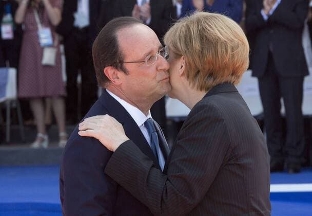 06 06 2014 President Francois Hollande of France and Angela Merkel of Germany at Sword Beach in Ouistreham, France for the International Ceremony to mark the 70th Anniversary of the D-Day. Picture by i-Images. UK OUT FOR 28 days from date of creation i-Images  IIM-2412-0043