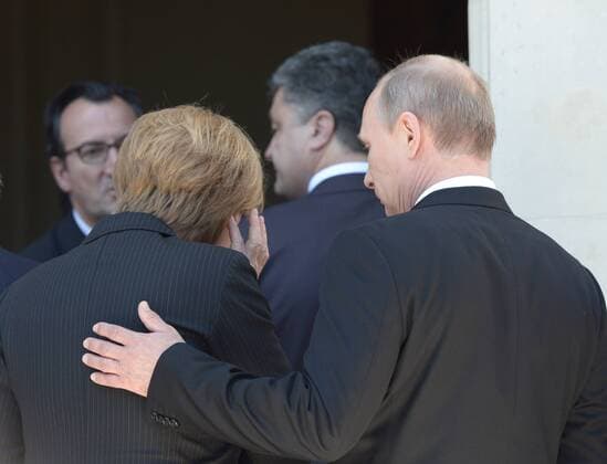ITAR-TASS: BENOUVILLE, FRANCE. JUNE 6, 2014. German Chancellor Angela Merkel, Ukraine s President-Elect Petro Poroshenko and Russia s President Vladimir Putin (L-R) pictured at Benouville Castle (Chateau de Benouville) ahead of the celebrations marking the 70th anniversary of the Allied Forces D-Day landings in Normandy.  RE146B7A
