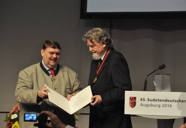 Milan Horacek, a German politician of Czech origin, right, and Sudeten German leader Berndt Posselt pictured during the 65th Sudeten German conference in Augsburg, Germany, June 7, 2014. Milan Horacek was awarded by Berndt Posselt for defending Sudeten Germans who were moved out of Czechoslovakia after the war. Horacek, 67, was born in Velke Losiny, north Moravia. His father was ethnic Czech, his mother ethnic German. In 1969, he emigrated from Czechoslovakia. Horacek was one of the founding members of the German Green Party. In 2004, he won a seat in the European Parliament for the Greens. (CTKxPhoto JakubxStrihavka) CTKPhotoOF201406090457301 