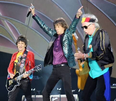 Ronnie Wood (L), Mick Jagger (C) and Keith Richards of The Rolling Stones perform in concert at the Stade de France near Paris on June 13, 2014.  PAR20140613703