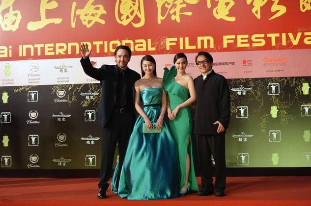 SHANGHAI, CHINA - JUNE 14: (CHINA OUT) John Cusack (L) and Jackie Chan (R) walk the red carpet at the 17th Shanghai International Film Festival (SIFF) on June 14, 2014 in Shanghai, China.  CFPpremiumd 20042934