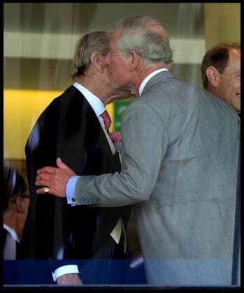 Image ©Licensed to i-Images Picture Agency. 18 06 2014. Ascot, United Kingdom. The Duke of Edinburgh kisses his son The Prince of Wales in the Royal Box on Day 2 of Royal Ascot at Ascot Racecourse. AndrewxParsonsx xi-Images  IIM-2483-0039