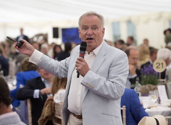 28 06 2014. Henley on Thames, United Kingdom. Jeffrey Archer conducts the charity auction , which raised £118,000 at The British Pole Day. Shiplake. i-Images  IIM-2546-0019