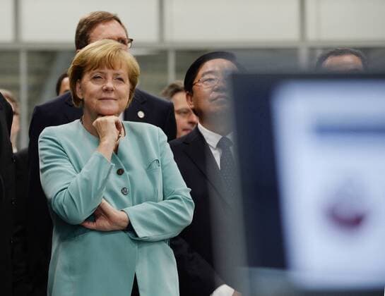 CHENGDU, CHINA - JULY 06: (CHINA OUT) German chancellor Angela Merkel visits FAW-Volkswagen Chengdu Factory on July 6, 2014 in Chengdu, Sichuan province of China. Invited by Chinese Premier Li Keqiang, German chancellor Angela Merkel has started her 3-day visit to China from July 6 to July 8, and she has arrived in Chengdu for business cooperation on July 6. Angela Merkel will visit Beijing after her 1-day visit in Chengdu. This is the 7th time that German chancellor Angela Merkel visit China.  CFPAufmacher premiumd 12446
