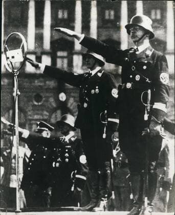 Sep. 09, 1943 - Picture shows Heinrich Himmler takes the salute at a March past of storm troops. Later he was appointed chief of German police.  - ZUMAk09