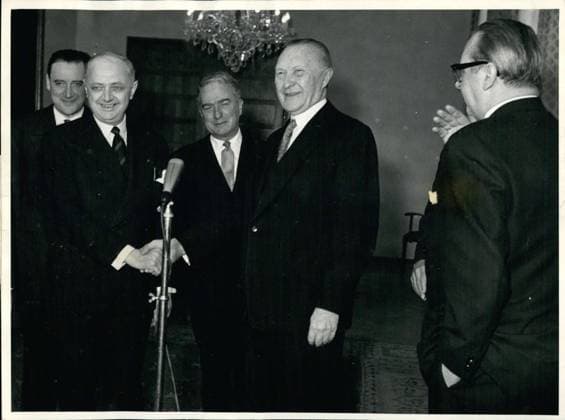 Mar. 03, 1956 - Pineau in Bonn... To speak about the reintegration of the Saar into the German area, the French Foreign Minister Pineau met in Bonn today with German Foreign Minister von Brentano. Pictured: Chancellor Dr. Adenauer and Minister Pineau exchanging greetings. Far right is Minister von Brentano.  - ZUMAk09
