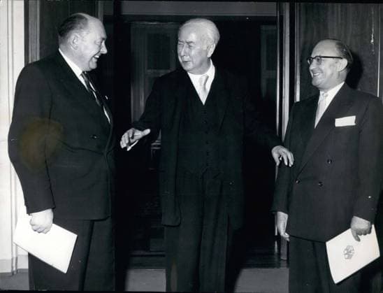 Oct. 16, 1956 - Federal President Heuss presented Justice Minister von Merkatz(left) and Nuclear Minister Balke(right) with their letters of appointment on Tuesday. The new Defense Minister Strauss is travelling to London and will receive his when he returns.  - ZUMAk09