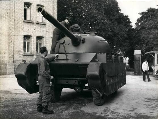 Sep. 09, 1957 - Tank dummies for the German Army: One of the greandier units stationed in Western Germany has received a tank-dummy for training which shall give the soldiers an idea how their training will be later with real tanks. (This dummy was constructed in a vehicle factory in Ulm ). Photo shows Major - general Pemsel (Pemsel), Commander of the 2nd Corps inspecting the tank-dummy.  - ZUMAk09