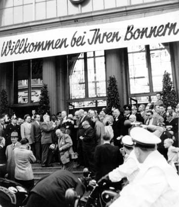 Apr. 22, 1953 - Bonn, Germany - Dr. KONRAD ADENAUER (1876-1967) was a German statesman who served as Foreign Minister and Chancellor of Germany. PICTURED: Citizens greet Konrad Adenauer with flowers. Bonn Germany  - ZUMAk09