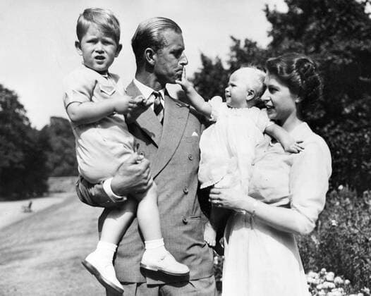 Aug. 9, 1951 - London, England, U.K. - The elder daughter of King George VI and Queen Elizabeth, ELIZABETH WINDSOR (named Elizabeth II) became Queen at the age of 25, and has reigned through more than five decades of enormous social change and development. PICTURED: QUEEN ELIZABETH and PRINCE PHILIP with their children PRINCE CHARLES and PRINCESS ANNE. London United Kingdom  - ZUMAk09
