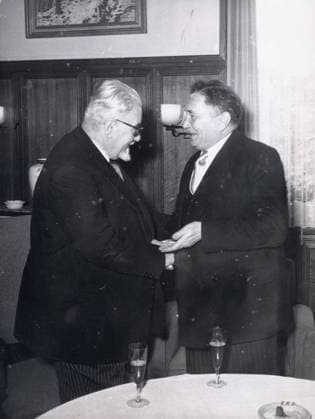 Nov 30, 1953 - Dusseldorf, Germany - PAUL RAMADIER (L) is greeted by Federal Secretary ANTON STORCH at the International Workers Organization meeting.. Dusseldorf Germany  - ZUMAk09